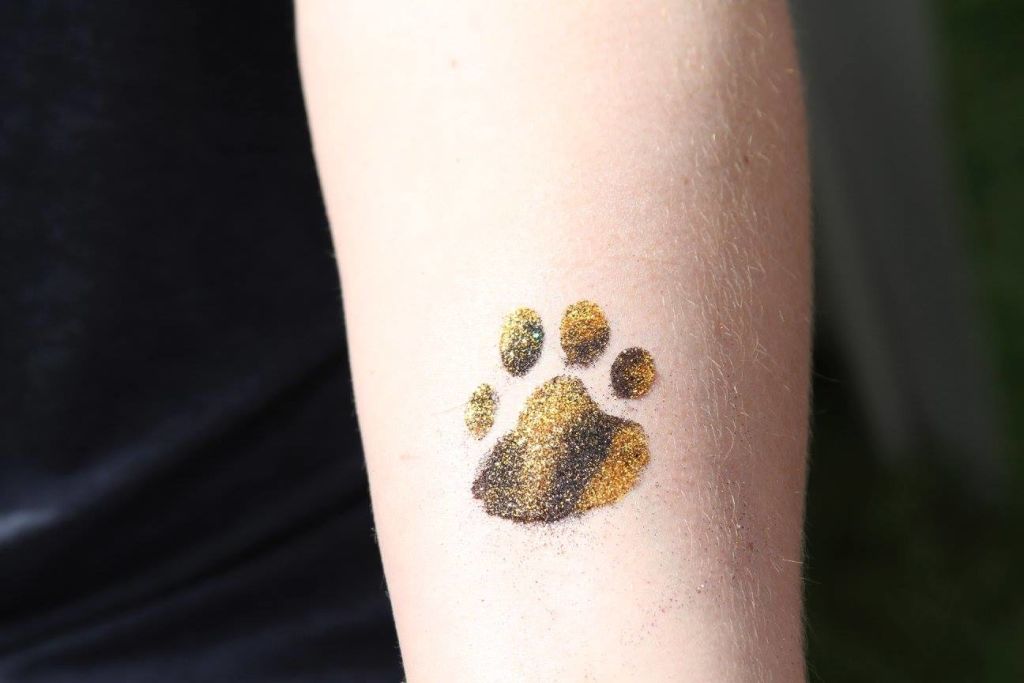  Gold and black paw glitter tattoo 